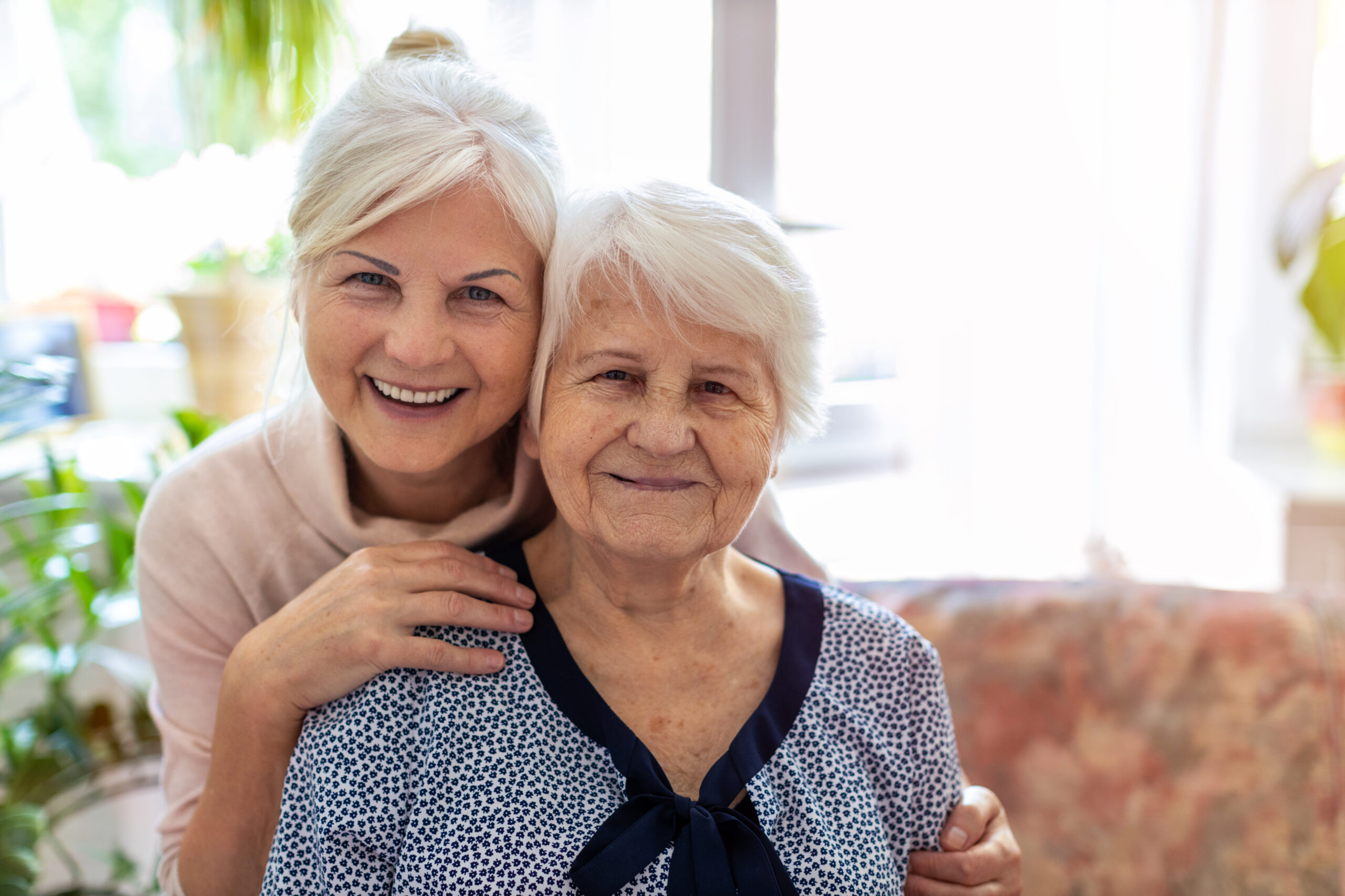 Woman spending time with her elderly mother, learning how to communicate with someone with dementia